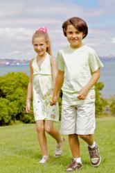 Tween boy and girl wearing Dhana EcoKids sustainable fashions